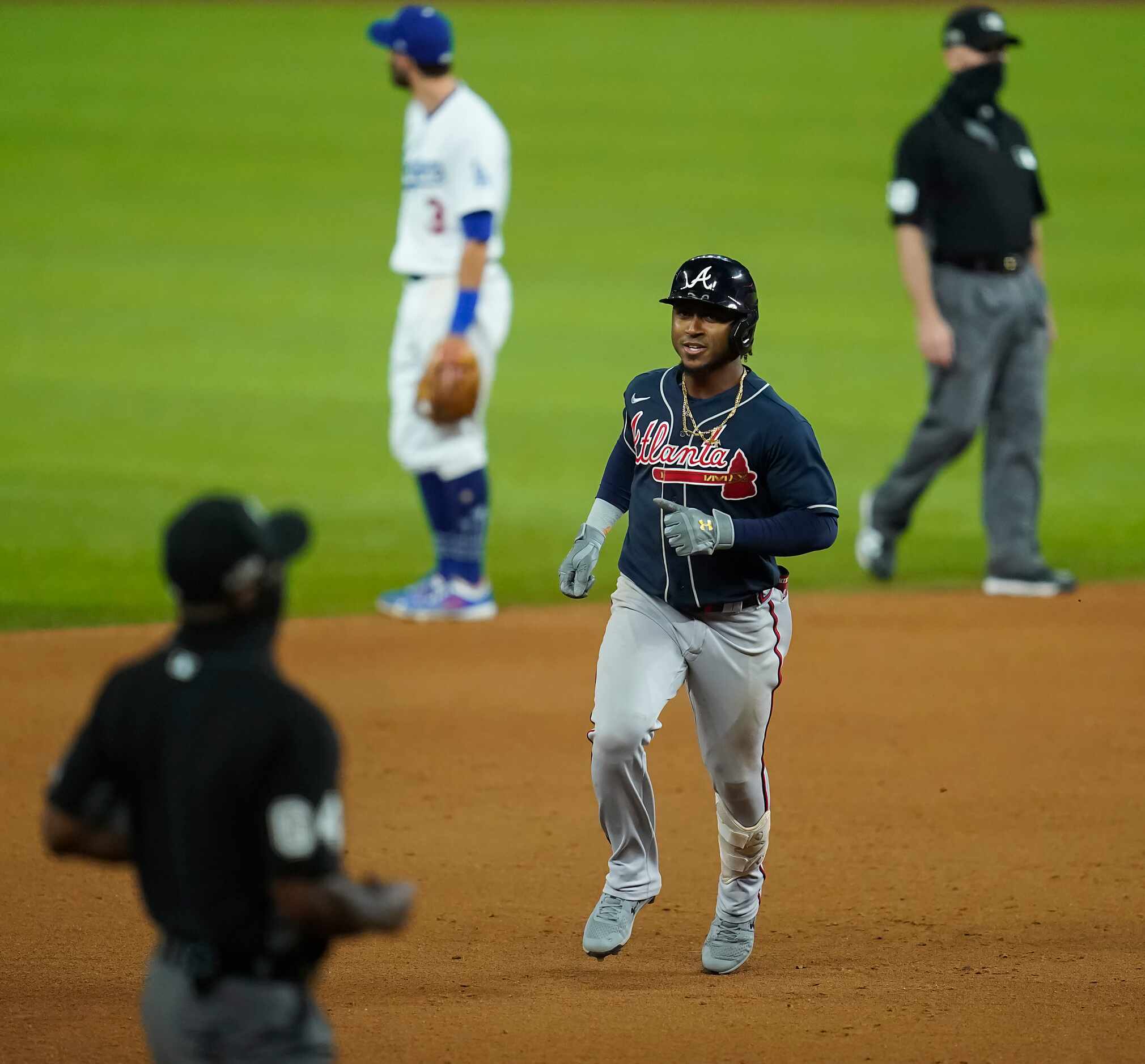 Atlanta Braves second baseman Ozzie Albies rounds the bases after hitting a solo home run...