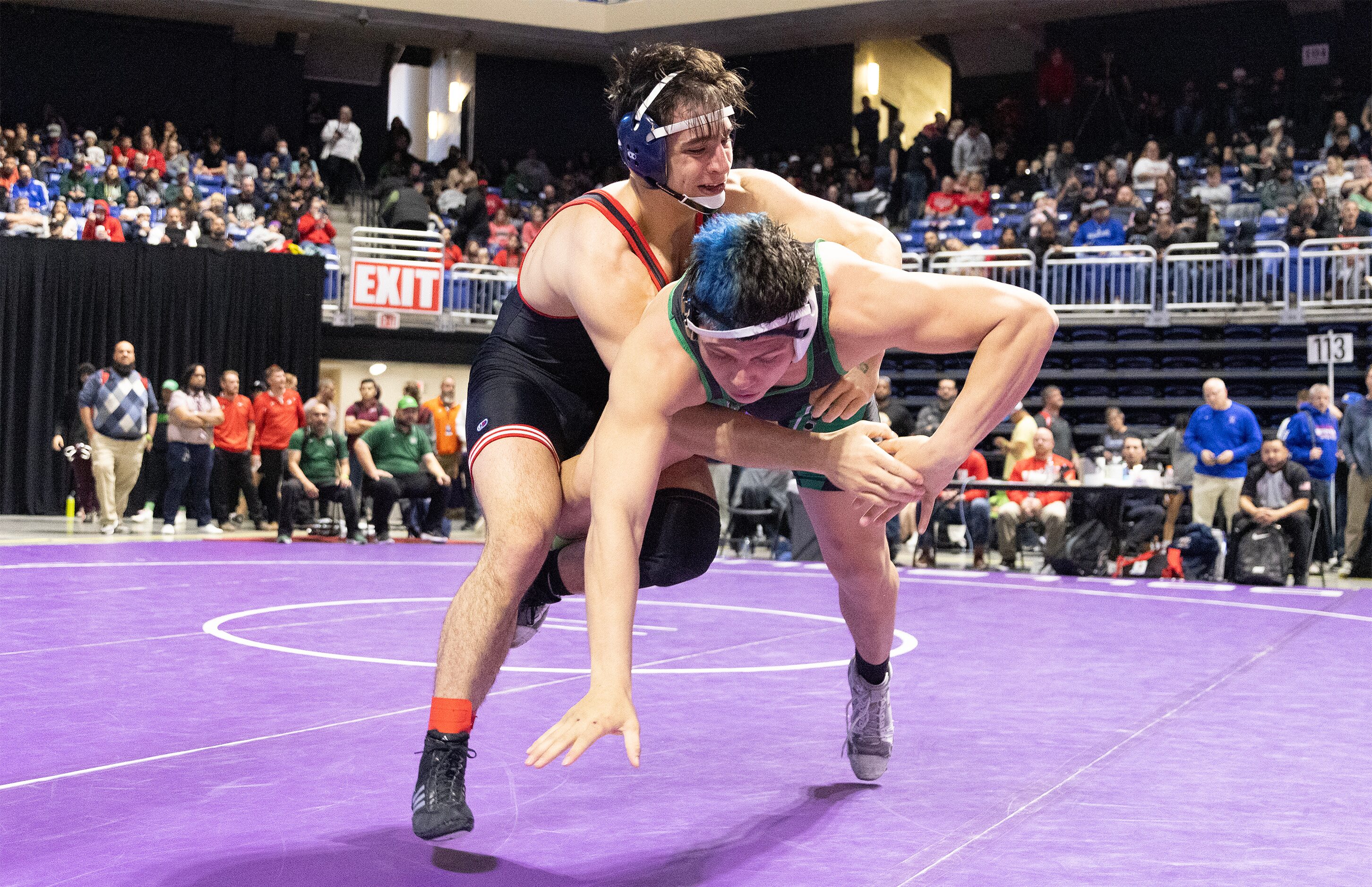 Ryan Nichols from Allen (top) wrestles Jose Angel Rosales in the 6A boys 215 pound division...