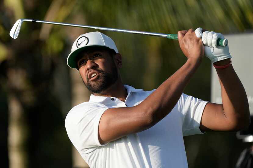 Tony Finau, of the United States, watches his tees off on the 11th hole during the Mexico...