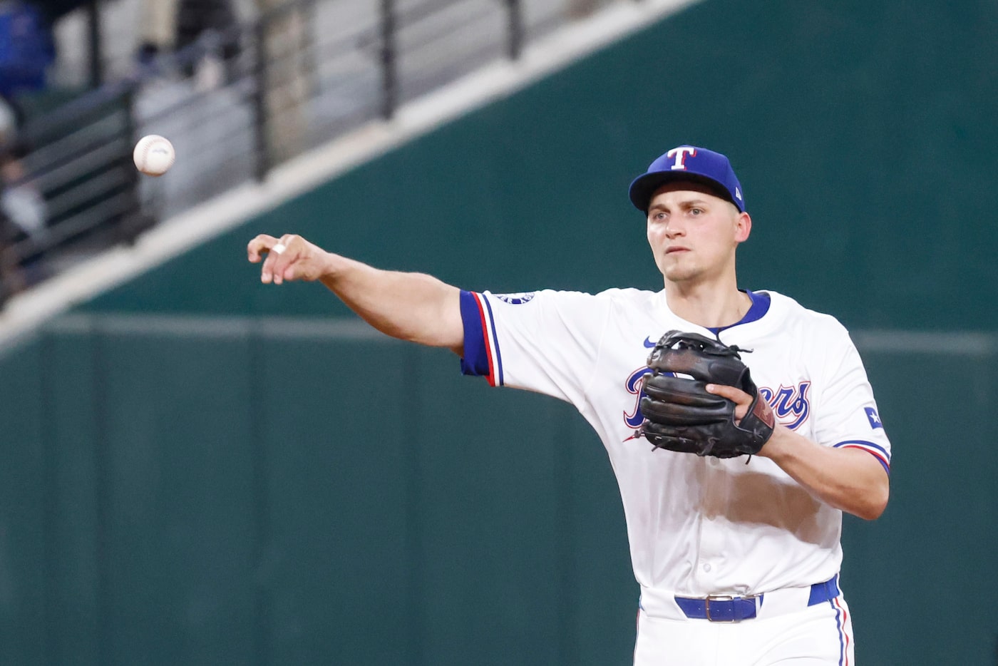 Texas Rangers shortstop Corey Seager throws the ball to the first base during the eighth...