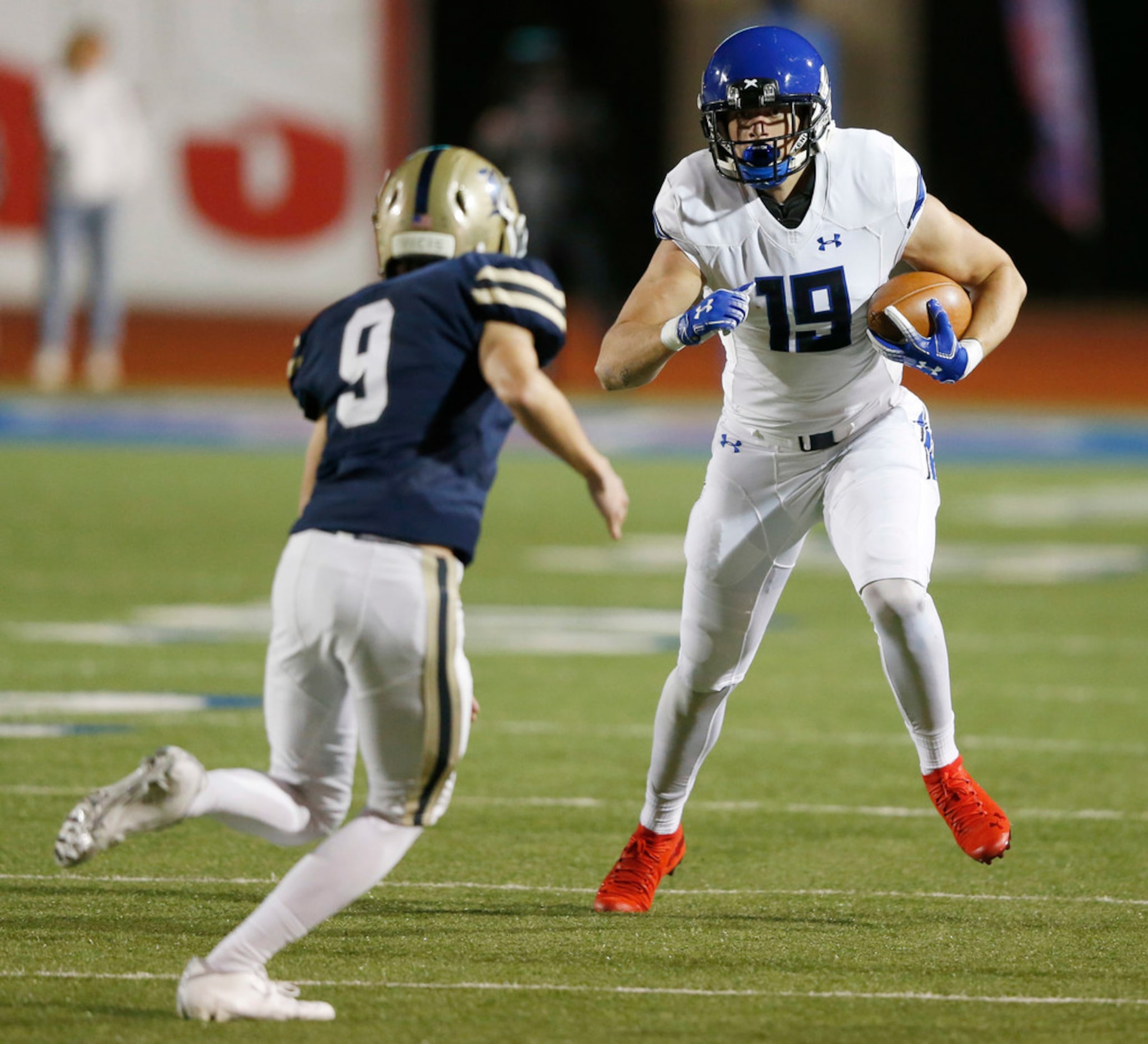 Trinity Christian's Elijah Yelverton (19) attempts to shake Austin Regents Cade O'Reilly (9)...