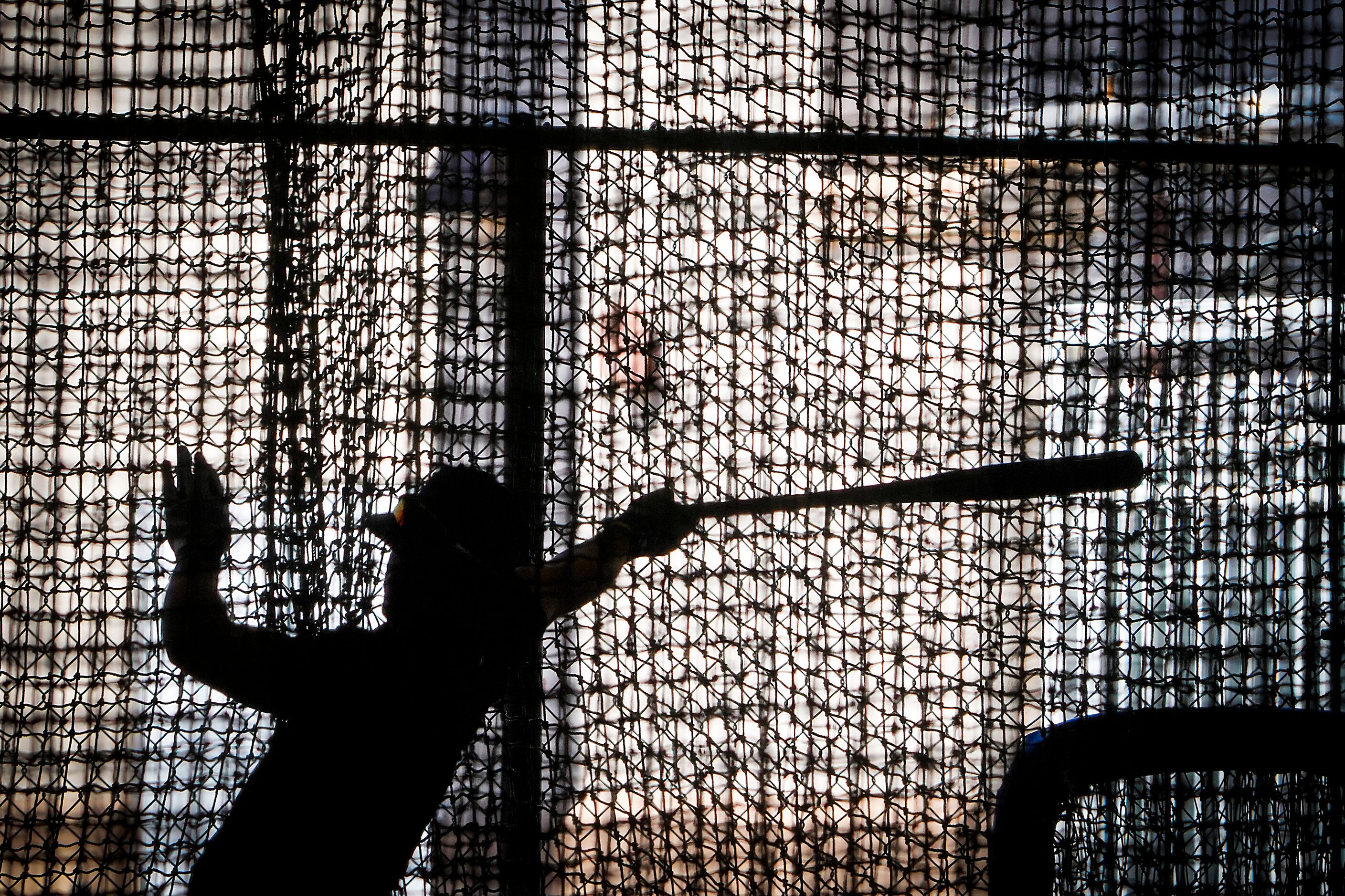 Texas Rangers minor league outfielder Trevor Hauver takes a swing in the indoor batting...