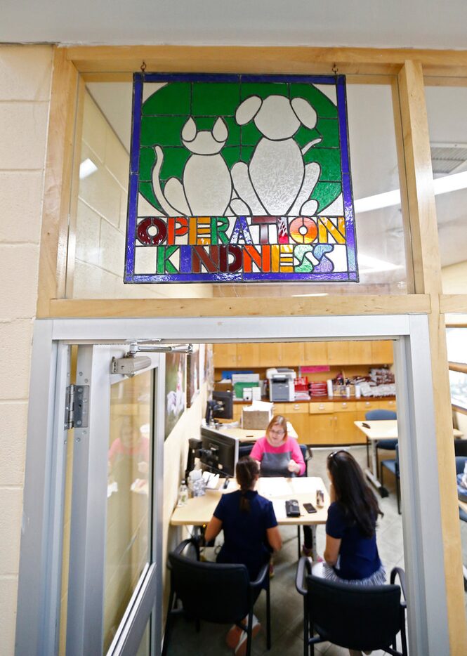 Sophia Villalba, 11, (bottom left) and her mom Brooke Villalba listen to instructions from...