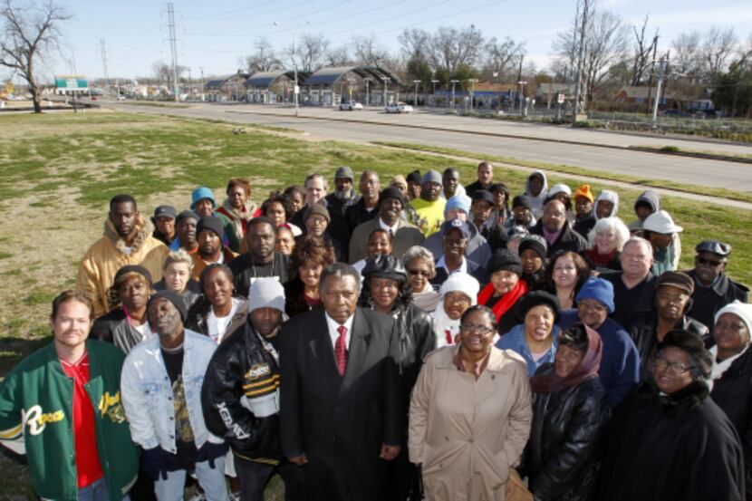 The Rev. Donald Parish (center), members of his church, True Lee Missionary Baptist Church,...