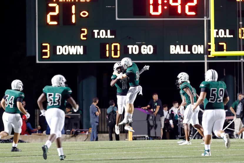 Mesquite Poteet WR Louis Moore (11) and QB Dalton Dale (10) celebrate in the end zone, after...
