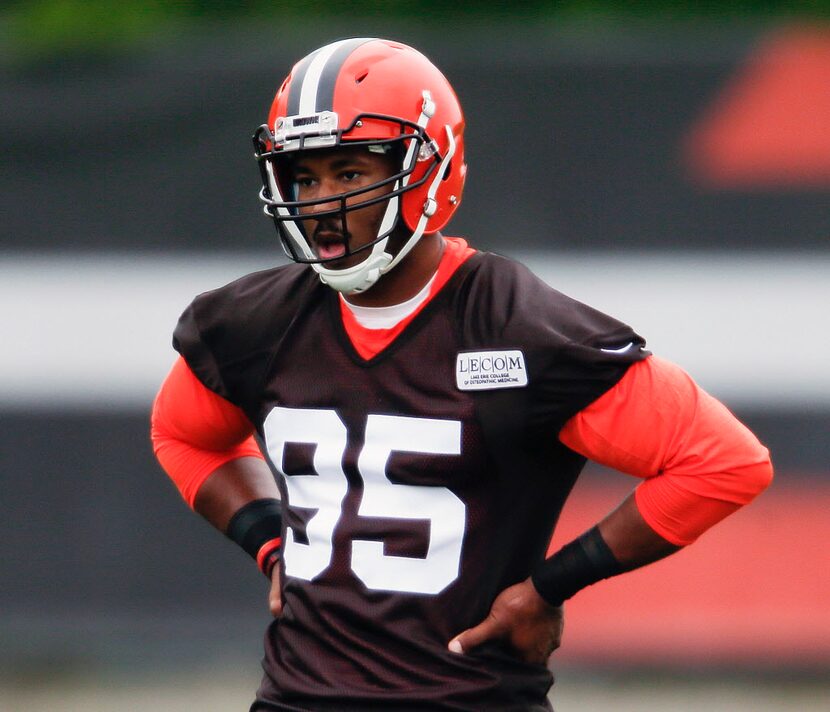 FILE - In this May 12, 2017, file photo, Cleveland Browns' Myles Garrett listens to his...