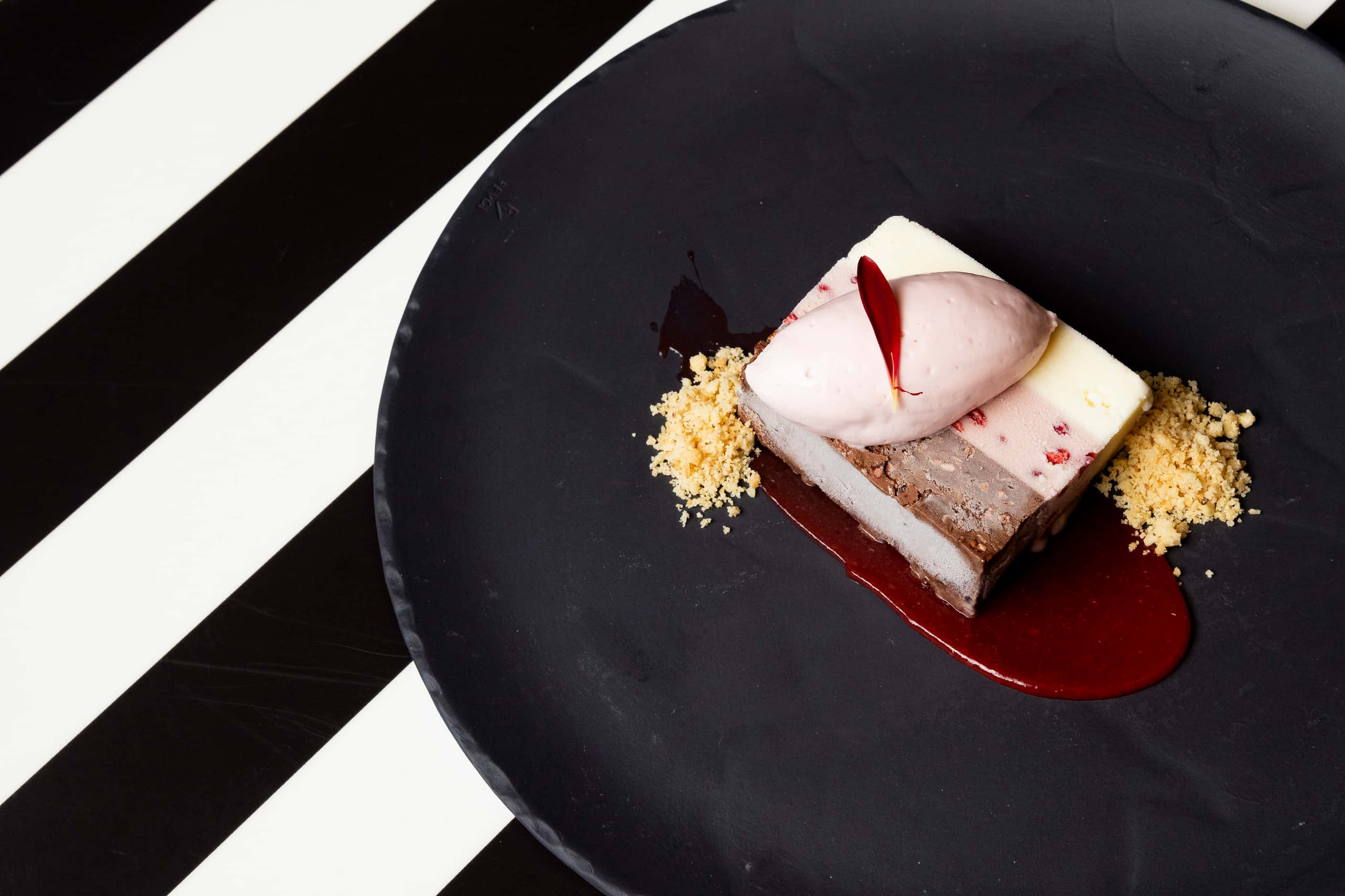 The Neapolitan Spumoni dessert at Knife Italian has layers of vanilla, chocolate and...