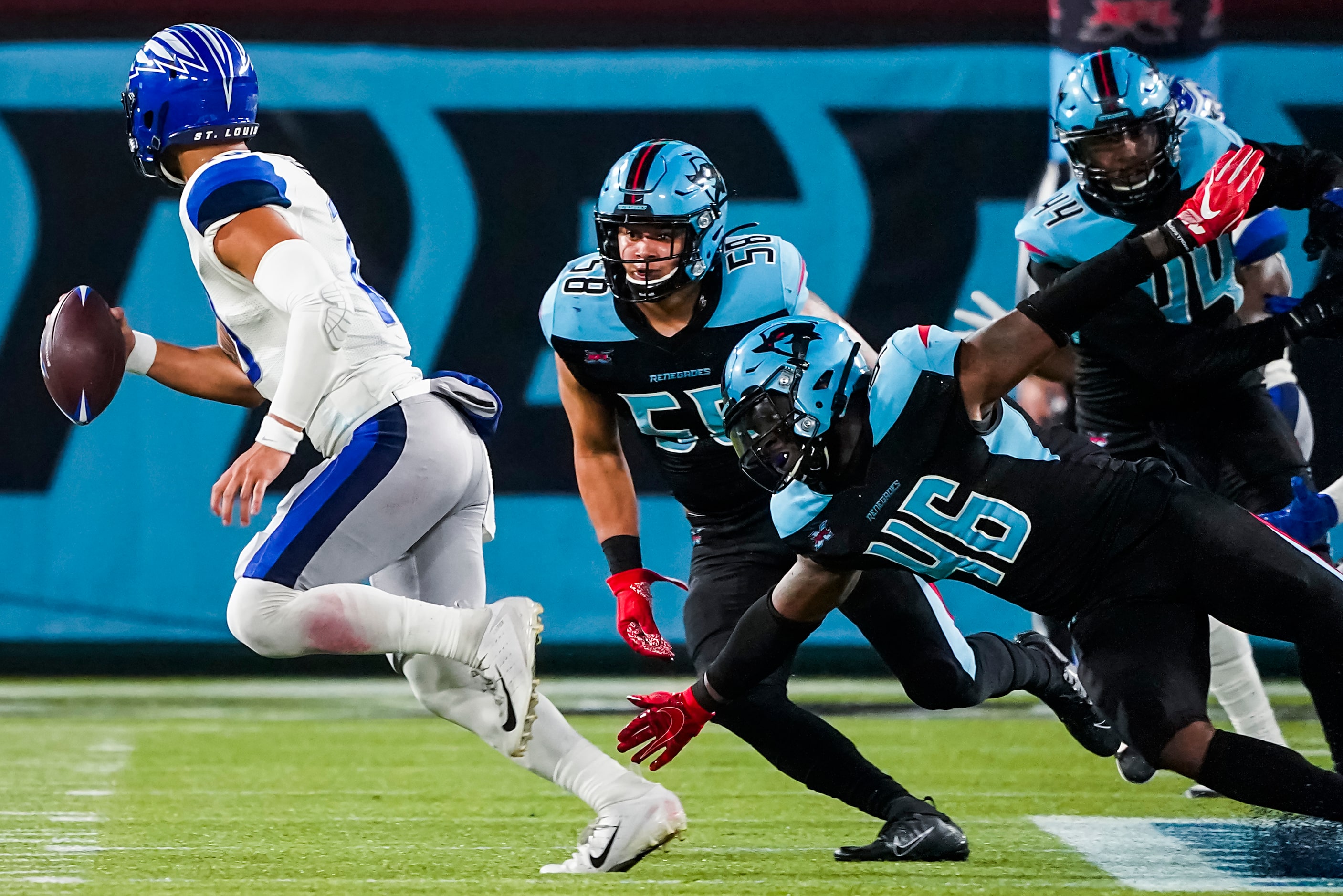 St. Louis Battlehawks quarterback Jordan Ta'amu (10) races away from Dallas Renegades...