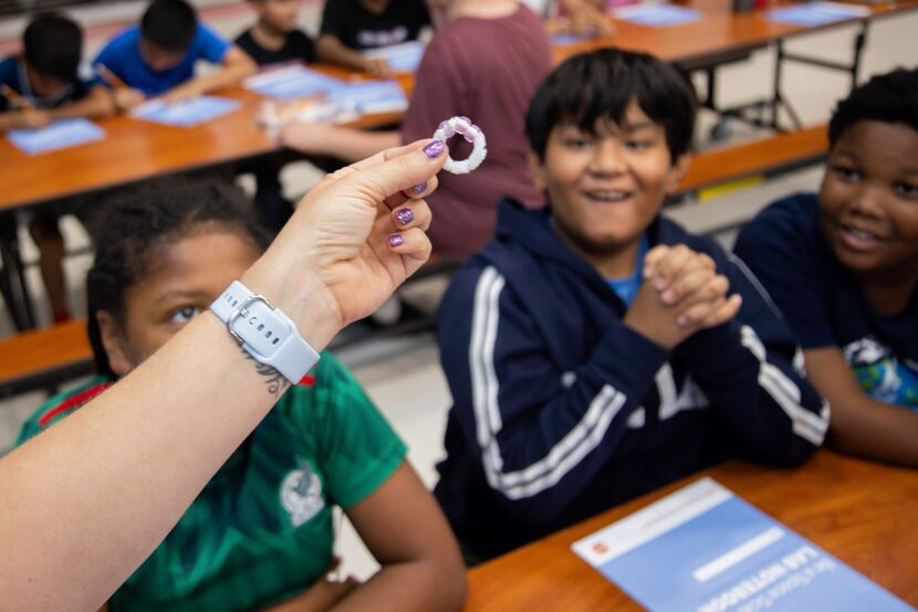 Kennedi Johnson, 9, from left, Orlando Plasencia, 10, and William Booker, 10, react as Penny...