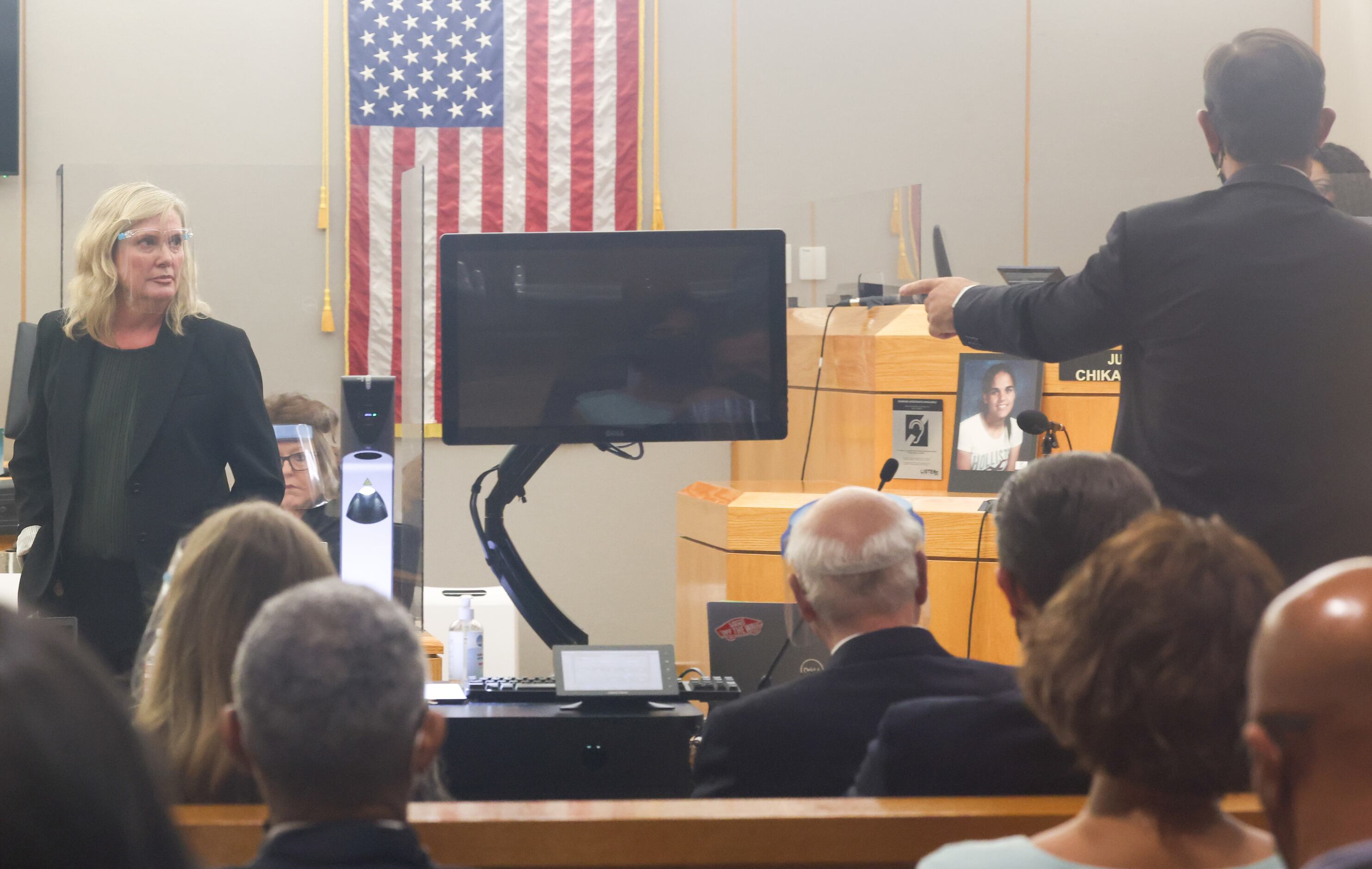 Prosecution lawyer Brandi Mitchell (left) pauses her closing remarks during an objection by...