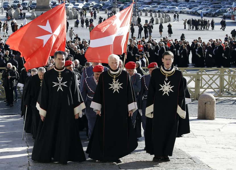 A file photo showing members of the Knights of Malta walk in procession towards St. Peter's...