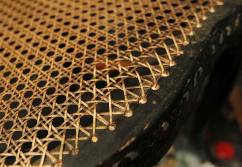 A detail shot of a finished handwoven rush seat for a chair restored by Louise Herriott at...