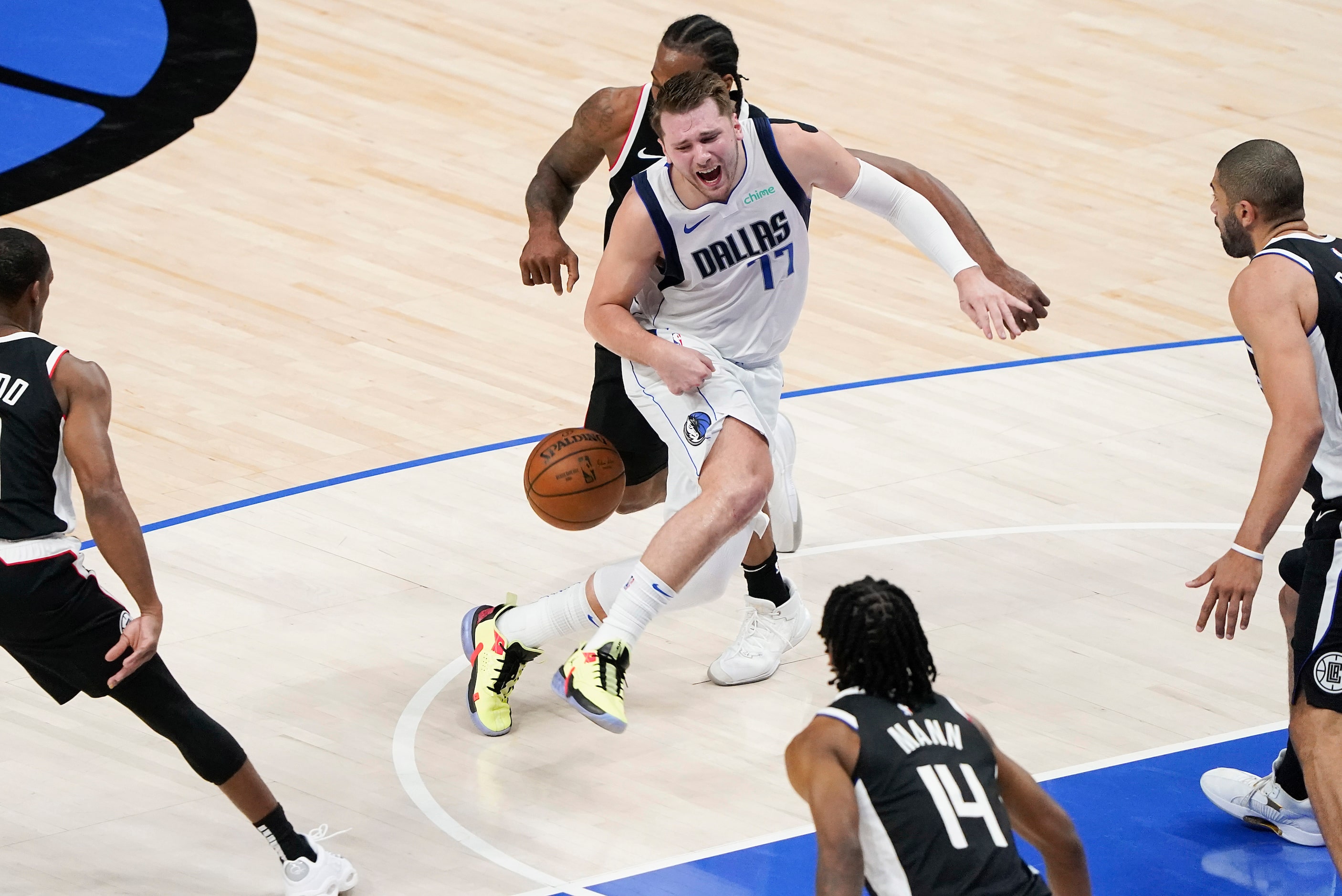 Dallas Mavericks guard Luka Doncic (77) has the ball knocked away by LA Clippers forward...