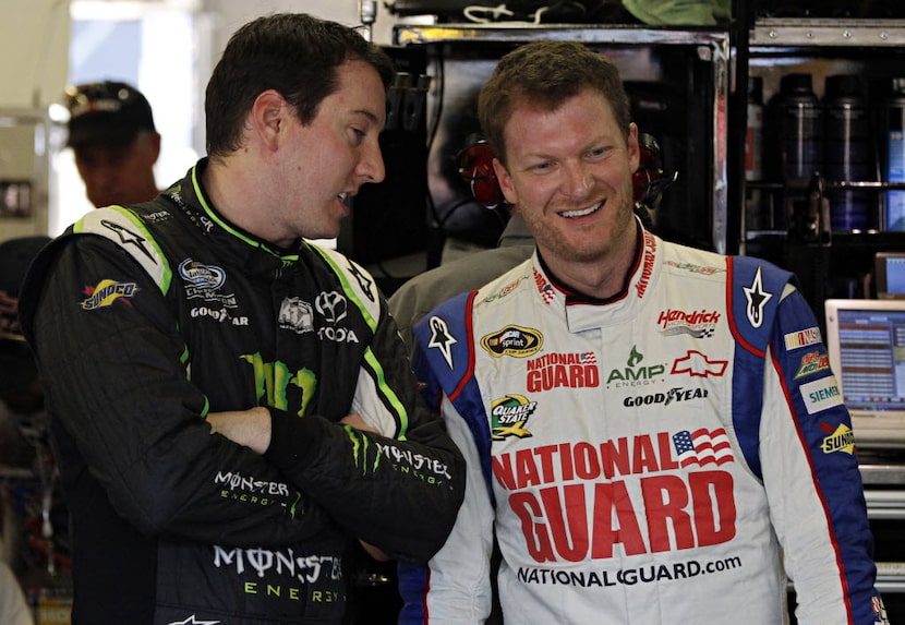 Kyle Busch (left) and Dale Earnhardt Jr. joke around in the garage during a practice session...