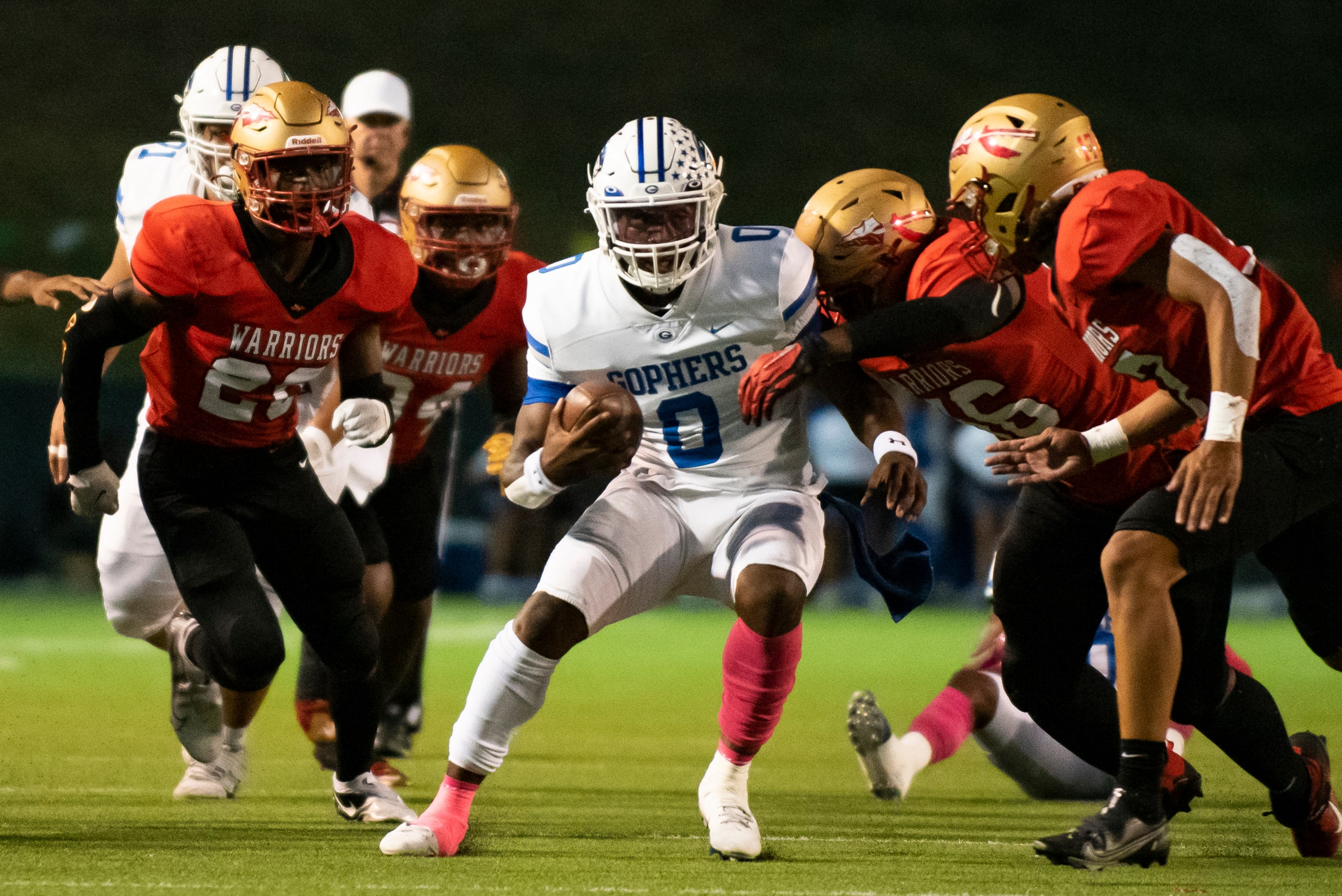 Grand Prairie senior Savion Red (0) looks to evade defenders during South Grand PrairieÕs...