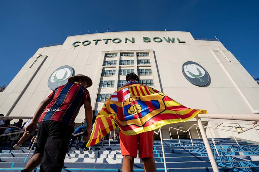 Fans of FC Barcelona walk into the Cotton Bowl before a soccer match against Juventus...