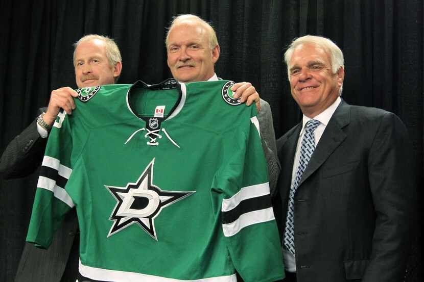 Dallas Stars general manager Jim Nill (left) with new coach Lindy Ruff (center).
