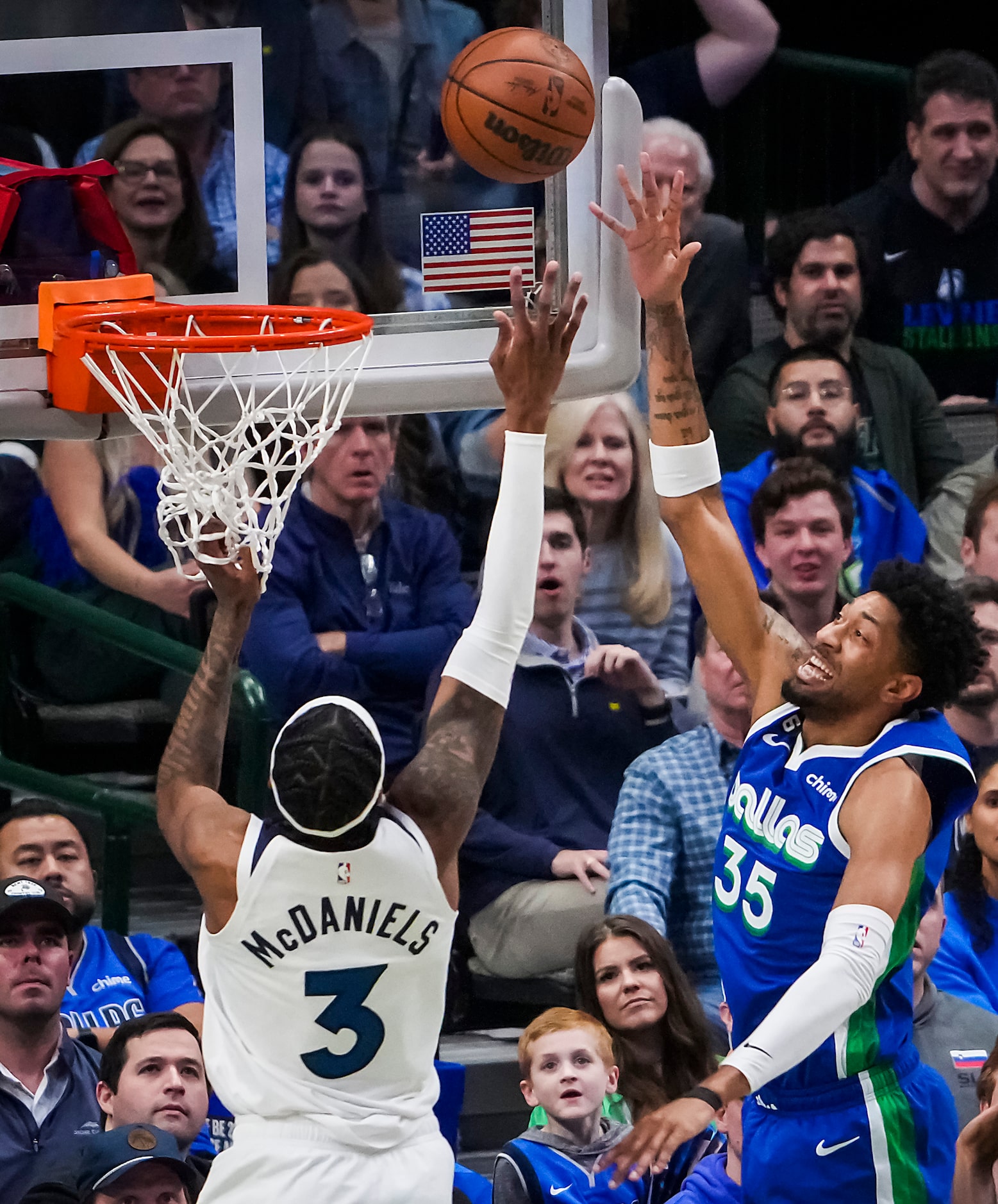 Dallas Mavericks forward Christian Wood (35) shoots over Minnesota Timberwolves forward...