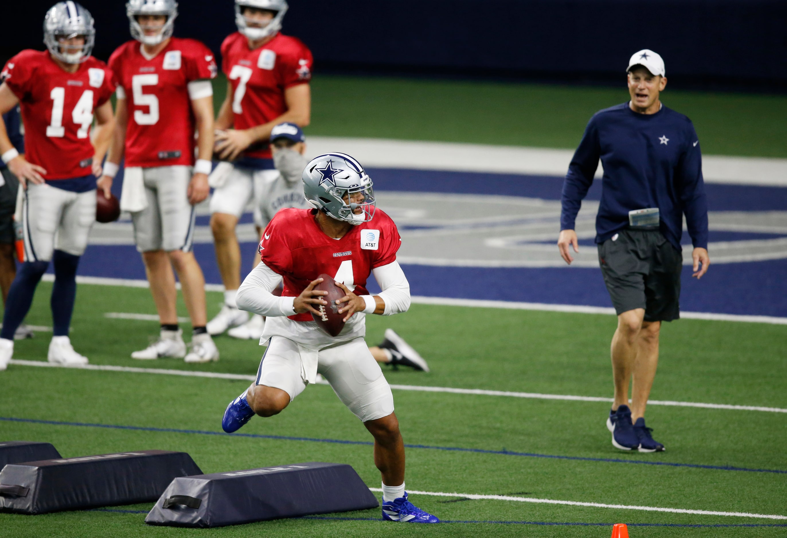 Dallas Cowboys quarterback Dak Prescott (4) runs through a drill during training camp inside...