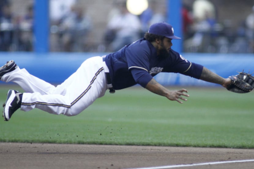 Prince Fielder of the Milwaukee Brewers makes a diving catch against the Los Angeles Dodgers...
