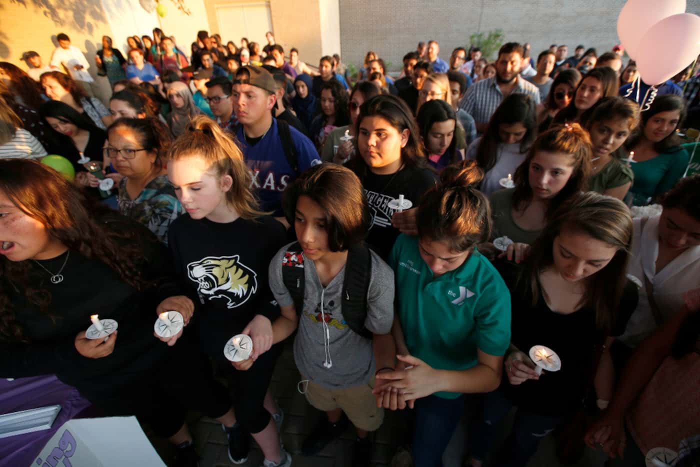 Friends gather during a memorial held for Janeera Gonzalez, at Irving High School in Irving,...