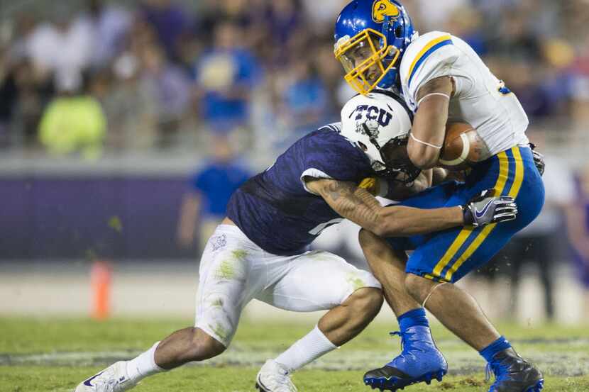  Isaac Wallace (right) of South Dakota State is brought down by Niko Small TCU during the...