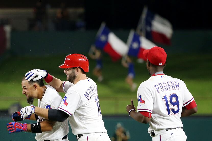 Texas Rangers second baseman Rougned Odor (12) celebrates with first baseman Mitch Moreland...