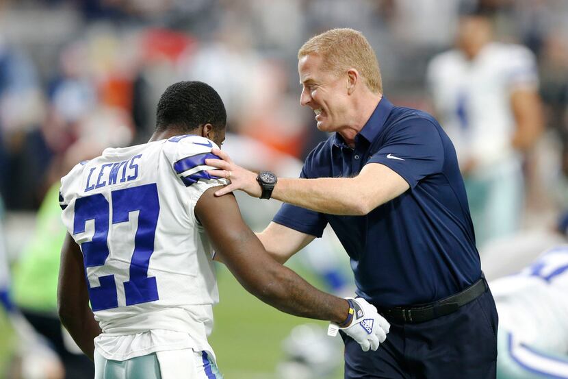 Dallas Cowboys head coach Jason Garrett pushes Dallas Cowboys cornerback Jourdan Lewis (27)...