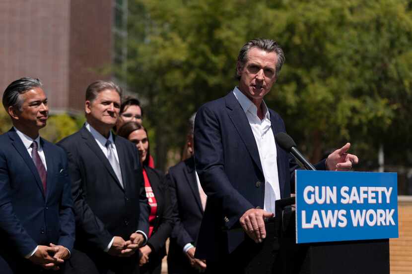 California Gov. Gavin Newsom speaks during a news conference as he is joined by California...