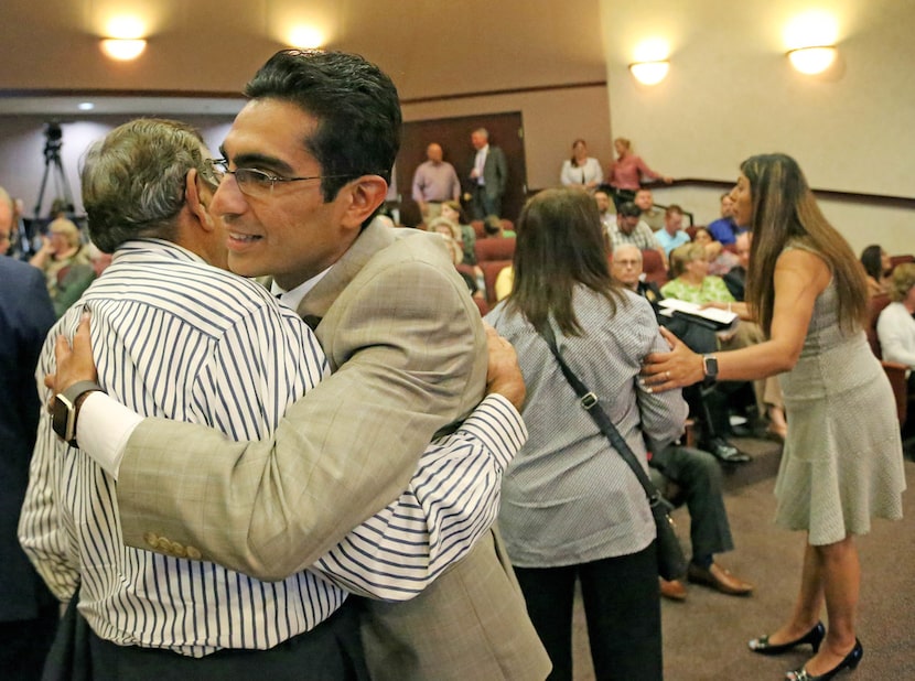 Bhojani's father-in-law, Pyarali Merchant, gave him a hug at last month's ceremony. 