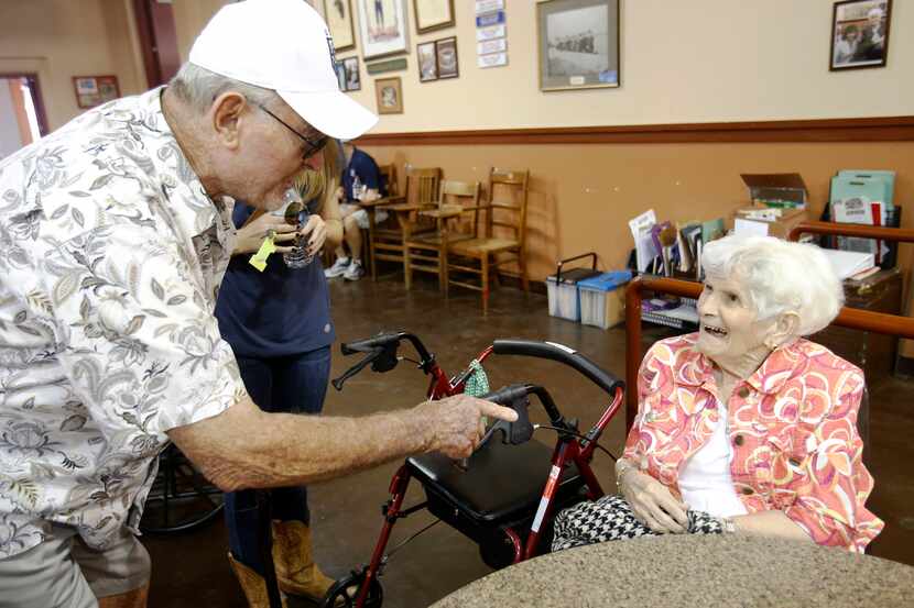 Glenn Moore talks with Wanda Fern Winter, known as Fernie, at The Dock at the State Fair of...
