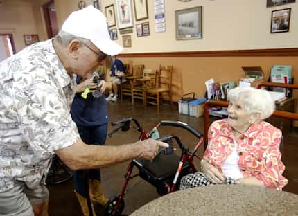 Glenn Moore talks with Wanda "Fernie" Winter, know as Fernie, at The Dock at the State Fair...