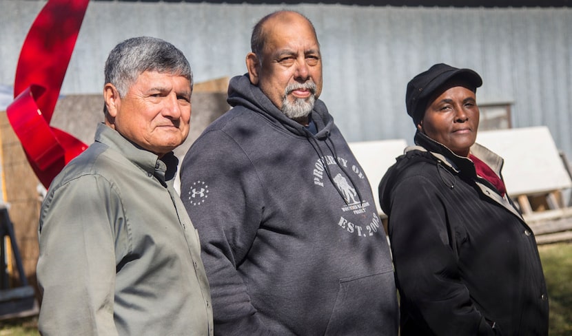 From left, U.S. Army veteran and sculptor Eliseo Garcia, and U.S. Navy veterans Ronnie...