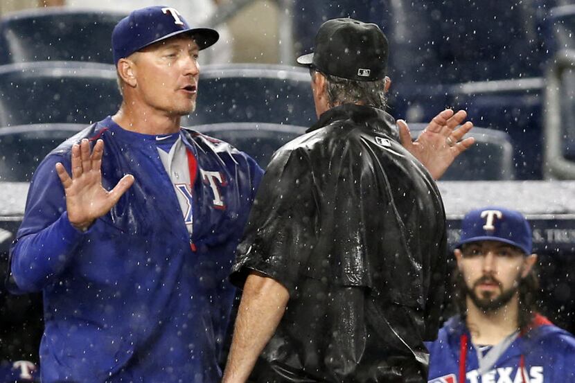 Texas Rangers manager Jeff Banister argues with crew chief Paul Nauert after umpires decided...