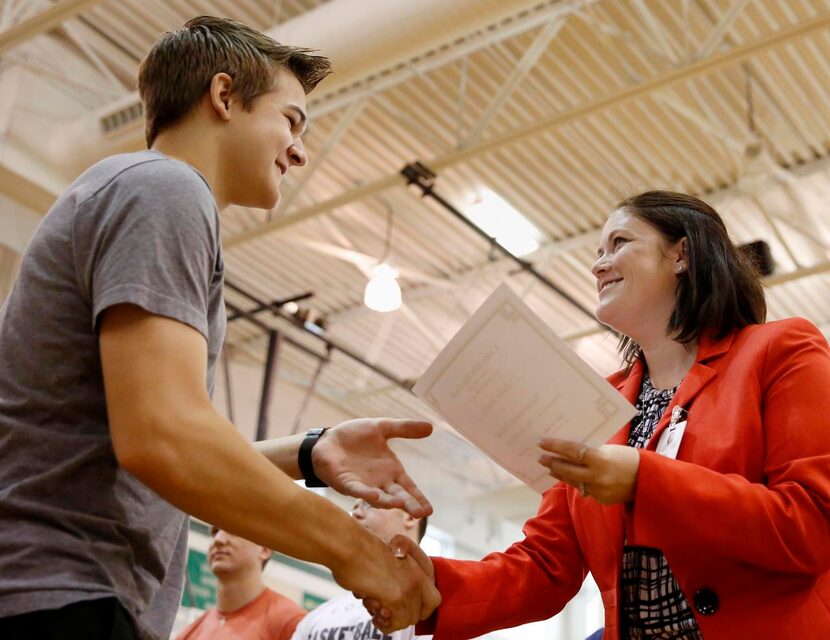 
Student Austin Sawatsky receives an award from Jana Everett during the Caddo Mills High...