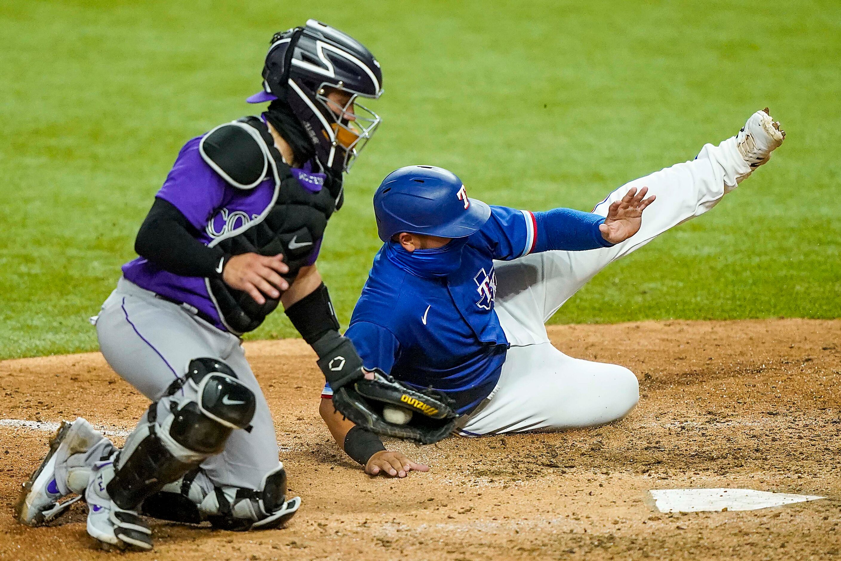 Texas Rangers catcher Jose Trevino is thrown out at home trying to score on a double by...