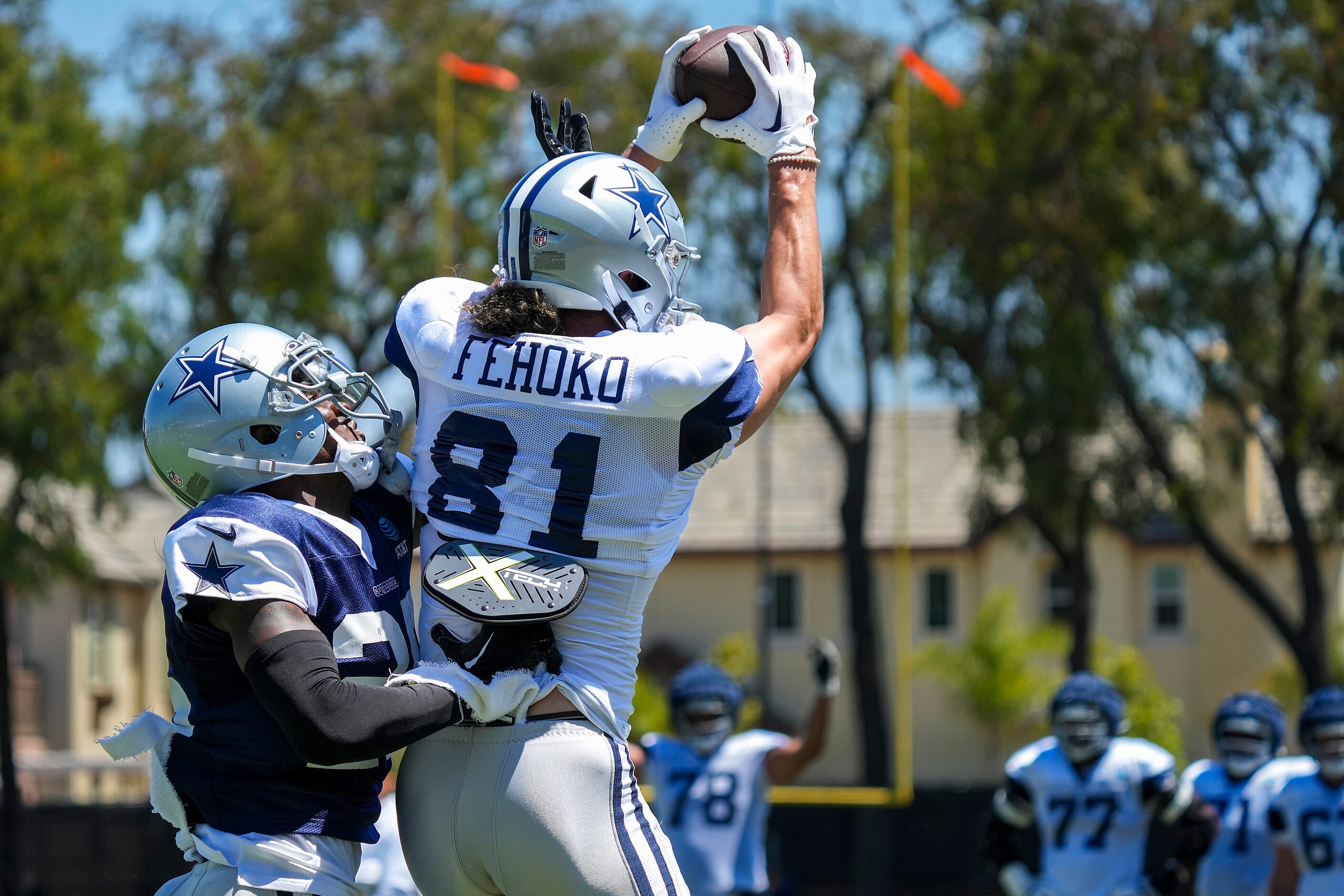 Dallas Cowboys wide receiver Simi Fehoko (81) catches a touchdown pass as cornerback Nahshon...