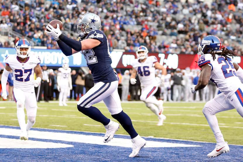 FILE - Cowboys tight end Jason Witten (82) catches a touchdown in front of New York Giants...