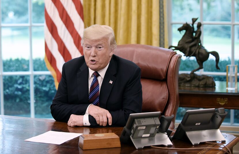 President Donald Trump talks to Mexican President Enrique Pena Nieto during a phone...