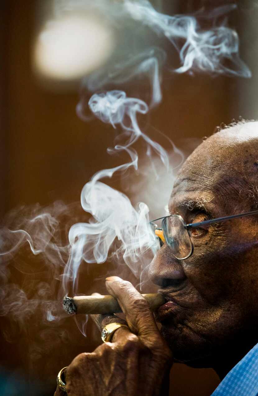U.S. Army veteran Richard Overton, 111, smokes a cigar at 6:41 a.m. on May 5, 2018 at his...