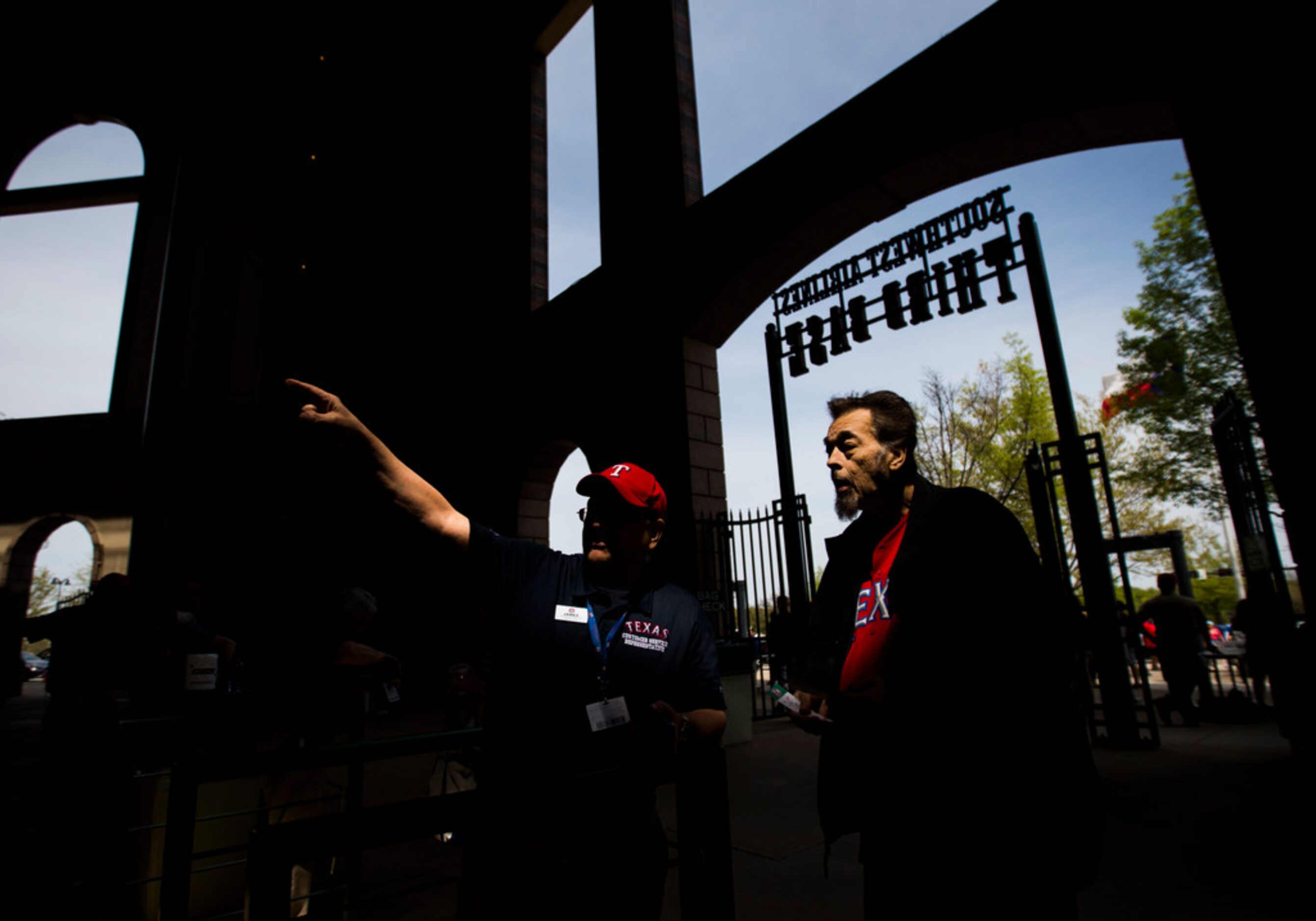 Usher James Symank points the way to Ricky Goldsmith's seat at the third base entrance of...