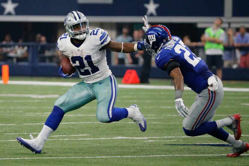 Dallas Cowboys running back Ezekiel Elliott (21) is pictured on a first-quarter run during...