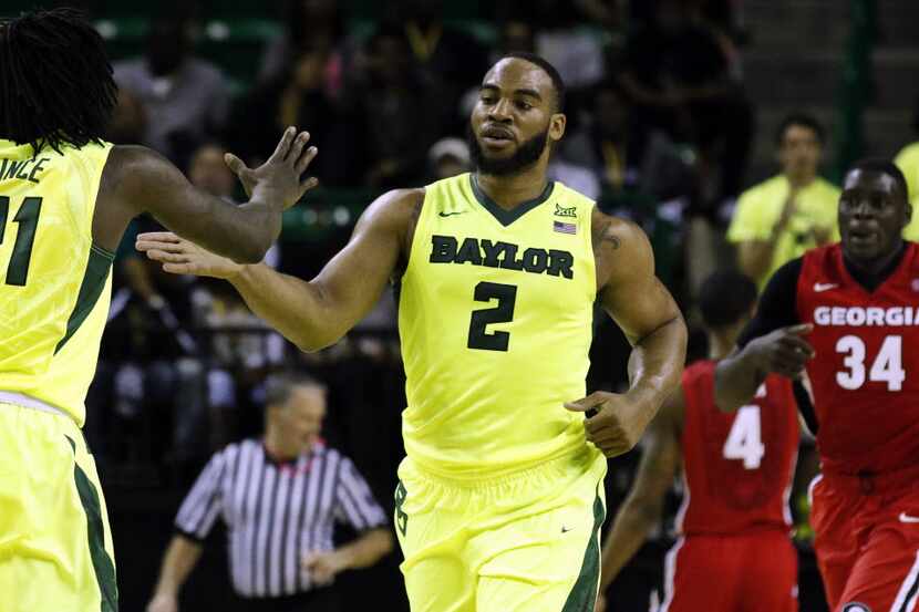 Jan 30, 2016; Waco, TX, USA; Baylor Bears forward Rico Gathers (2) high fives forward...