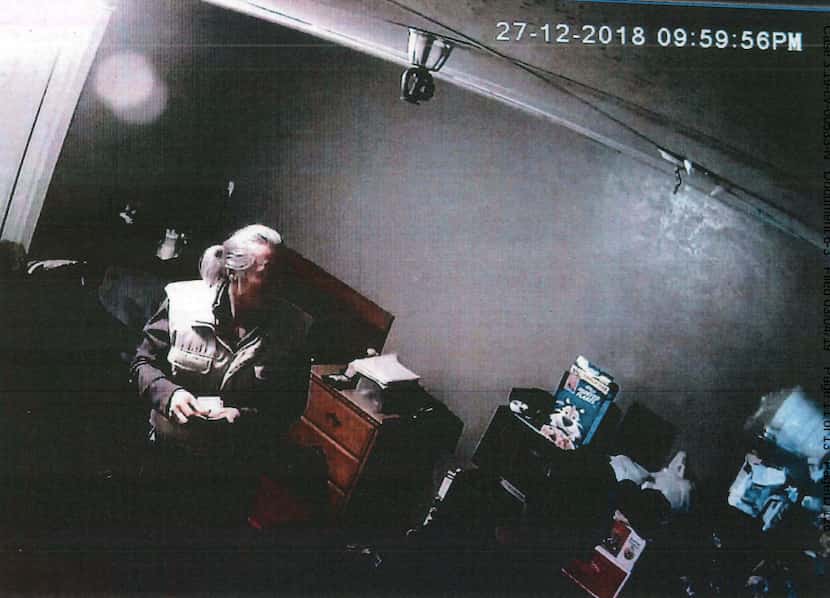 Federal prosecutors say this is Amos Mun collecting cash in one of the "trap" rooms in his...