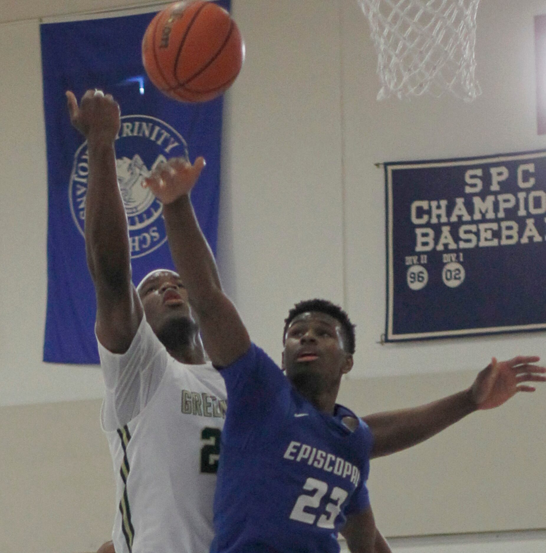 Greenhill's Lee Dort (22), left, battles Houston Episcopal's Jonathan Burroughs (23) during...