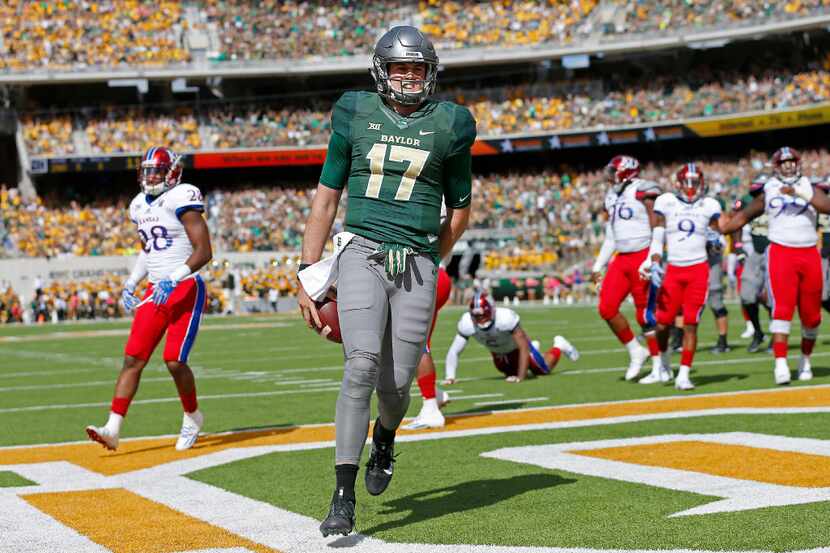 Baylor quarterback Seth Russell (17) scores a touchdown against Kansas during the first...