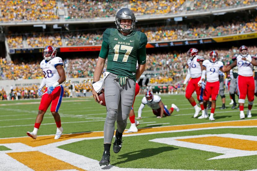 Baylor quarterback Seth Russell (17) scores a touchdown against Kansas during the first...