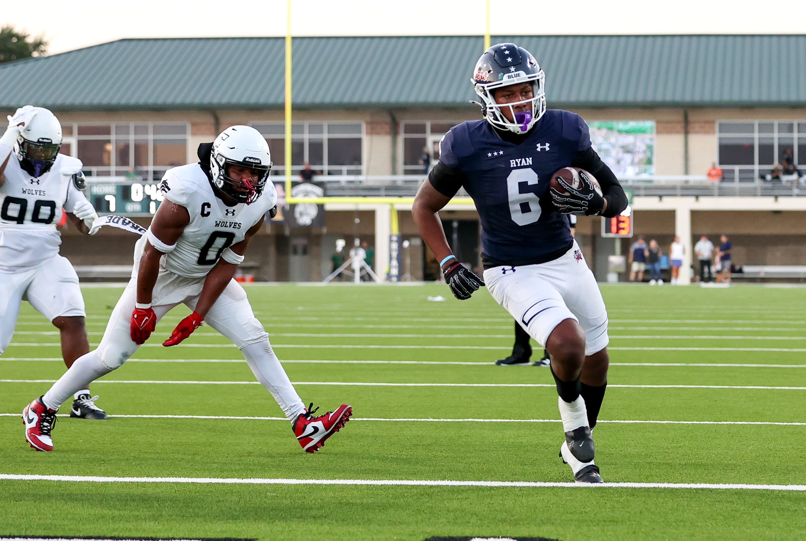 Denton Ryan running back Nemo Warmate (6) gets into the endzone for a 2 yard touchdown run...