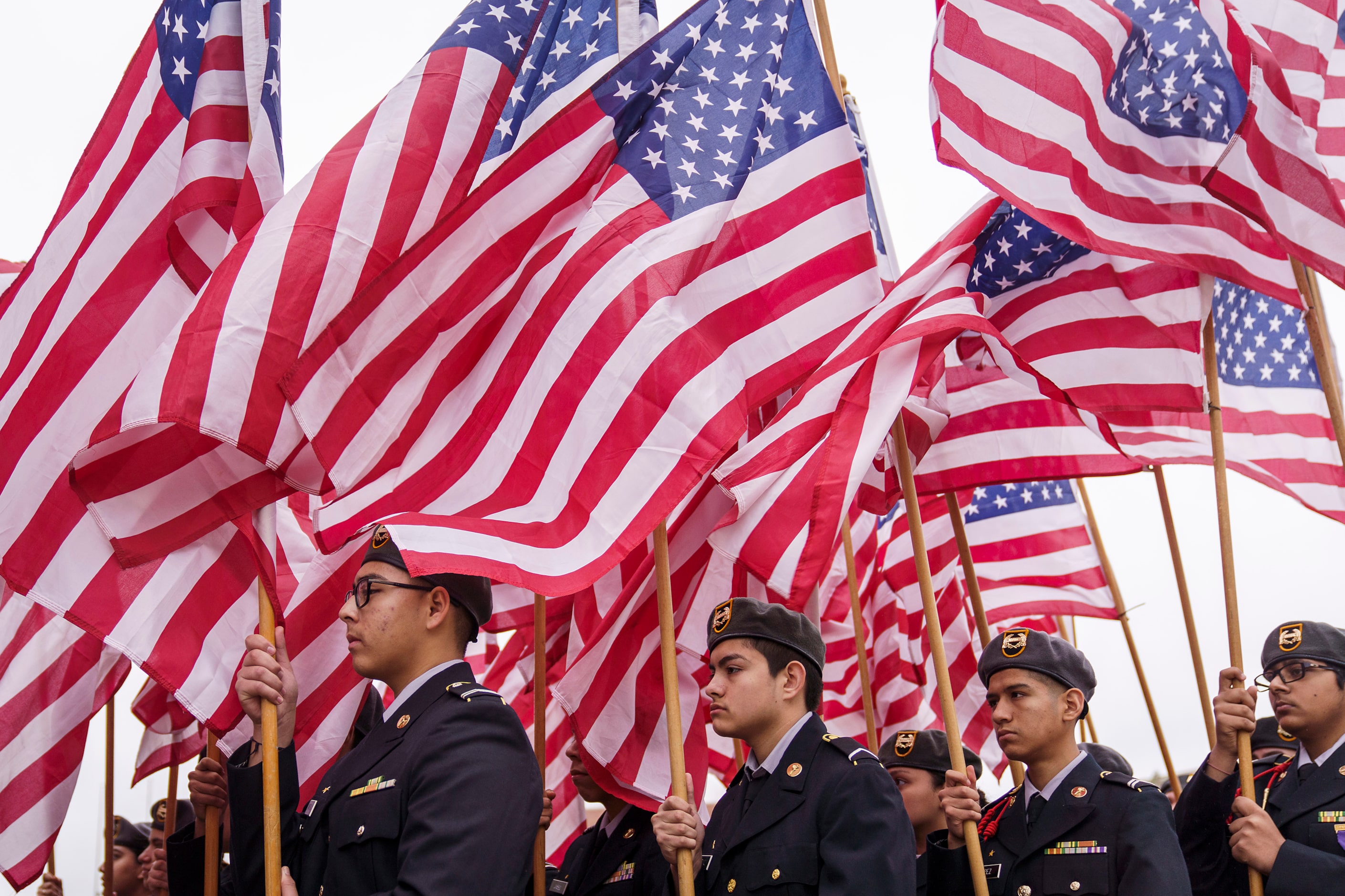 DISD JROTC cadets participate in the Massing of the Colors during an 11th hour ceremony at...