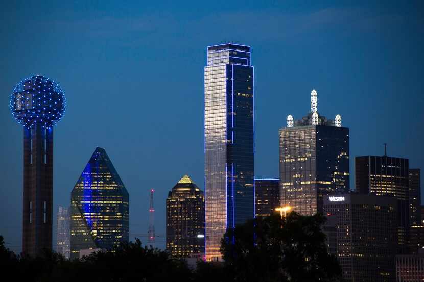 The downtown Dallas skyline lights up in blue in recognition of National Police Week on...